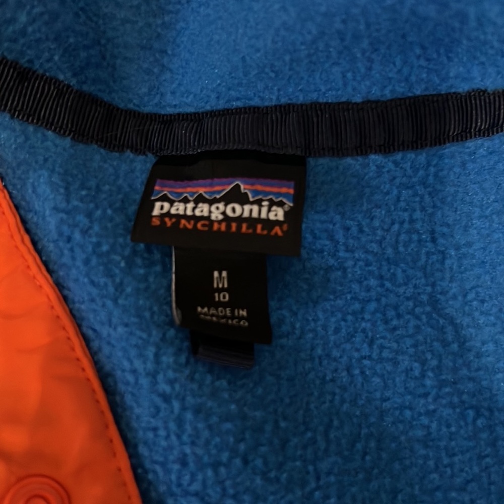 Blue, navy, and orange Patagonia 1/2 zip sweatshirt.